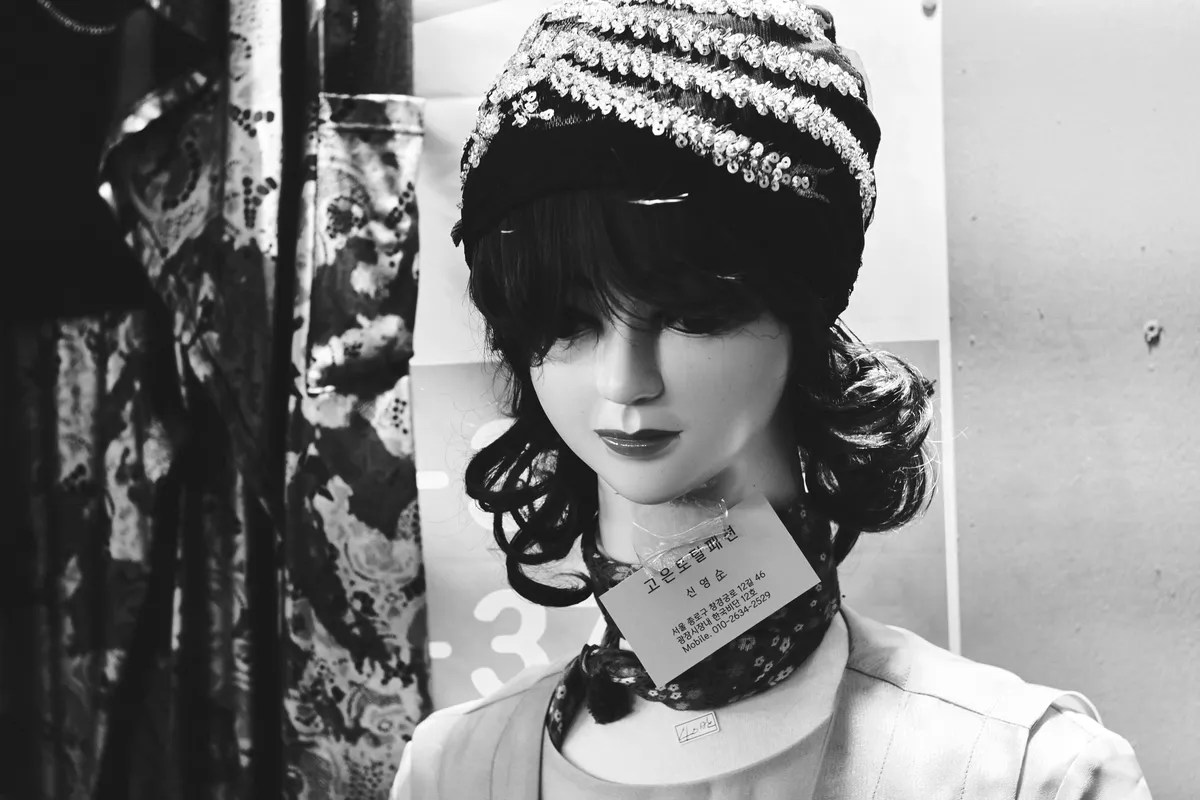 Mannequin head in a knit cap, in black and white