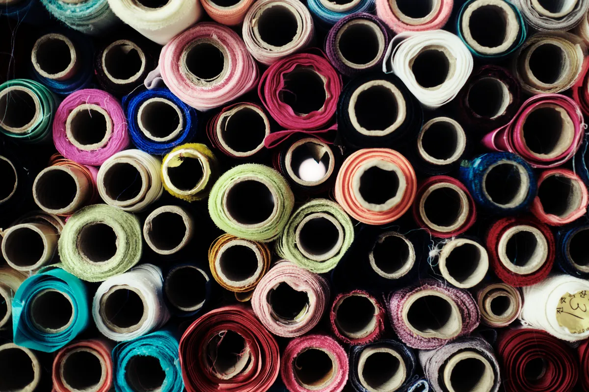Rolls of colorful fabric seen from above