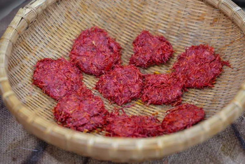 Safflower cakes from June resting in a bamboo basket